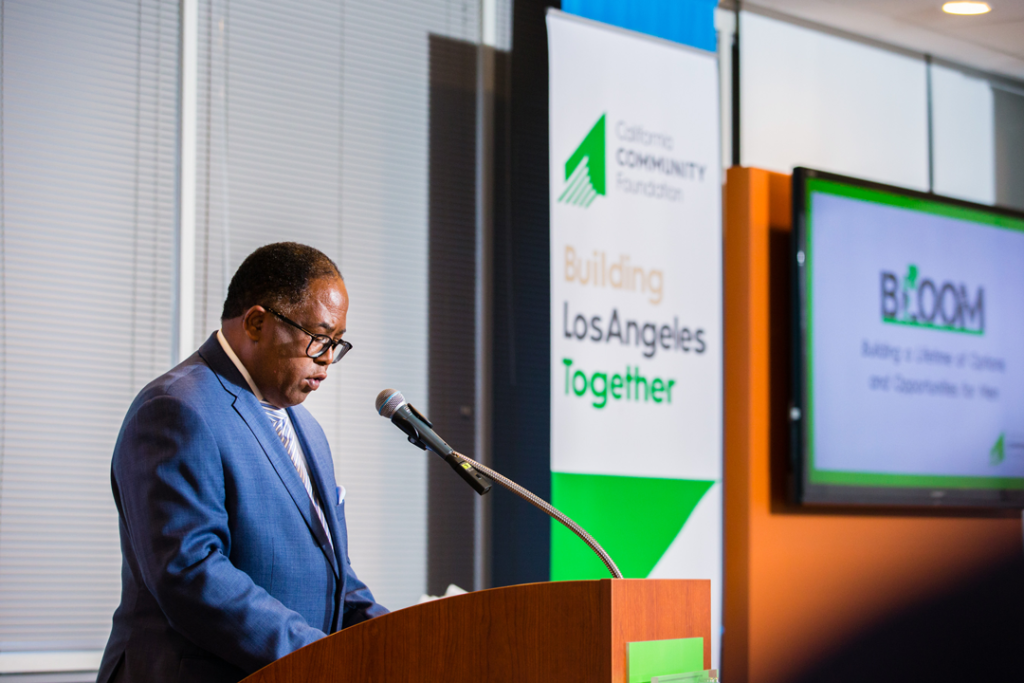 LA County Supervisor Mark Ridley-Thomas speaking at the BLOOM commencement ceremony