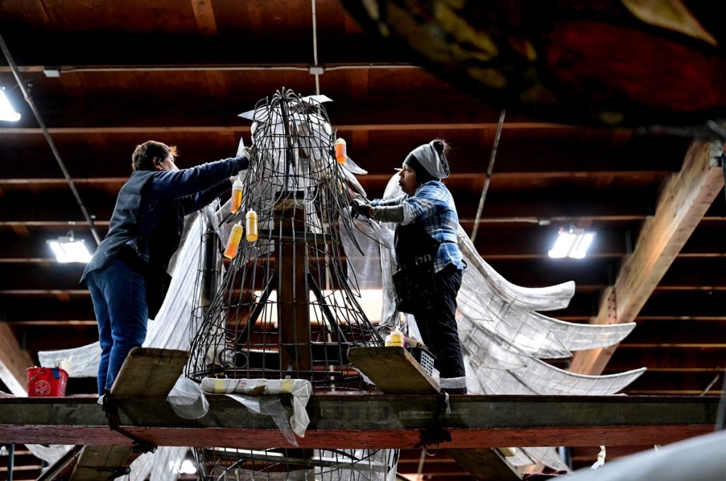 Rose Parade float preparation.