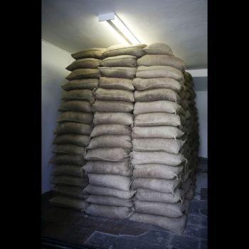 "Motown Took Us There And Motown Brought Us Back", 2005-2008, 500 sandbags, 8 tons of sand, graphite on wall and sound, 6 ft. x 5 ft. x 12 ft. Vincent Ramos