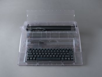 Prison Relic #2: Typewriter, 2012, Framed photograph, book, cardboard shelf, chain, 50 in. x 20 in. x 9 in. Jennifer Moon