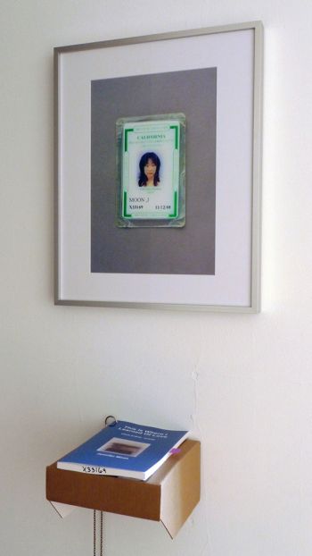 Prison Relic #1: CDC ID, 2012, Framed photograph, book, cardboard shelf, chain, 50 in. x 16 in. x 9 in. Jennifer Moon
