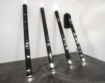 Installation view of White Noise, 2013, fluorescent shop lights, polypropylene rope, coat, dimensions vary York Chang