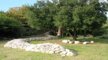 La Culebra within La Tierra de la Culebra ArtPark, 1992-2014, riverstone, concrete, piqued remnants, 500 ft. x 6 ft. x 3 ft. within 30,000 sq ft site Tricia Ward