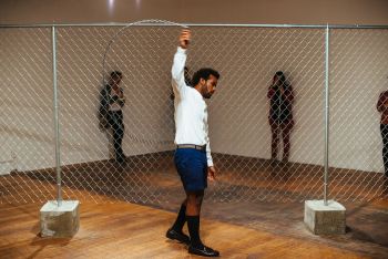 The Fence Mechanisms, 2014, Commonwealth & Council, Los Angeles, chain link fencing, concrete, beaded jump rope, durational performance, dimensions variable, Photo: Craig Kirk EJ Hill