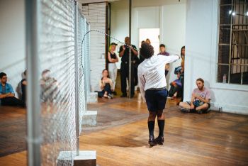 The Fence Mechanisms, 2014, Commonwealth & Council, Los Angeles, chain link fencing, concrete, beaded jump rope, durational performance, dimensions variable, Photo: Craig Kirk EJ Hill