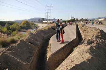 The Unfinished, 2014, dirt, asphalt, untrained mechanized labor and existing post-industrial state owned land, 137 ft. obeliskine form within a 160 ft. x 35 ft area Michael Parker