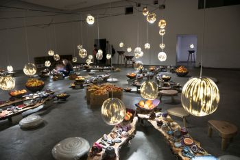 Juicework, 2015, stoneware, porcelain, tree slabs, cushions, stools, lights, cables, water, towels, redwood, steel, plumbing, electronic foot pedals, citrus, installation throughout old movie theatre Michael Parker