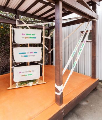 Samoa, installation view of Los Angeles Museum of Art (LAMOA), 2013, spray paint on cotton drill, lazy susan, wood, daisies, 9 ft. x 12 ft. x 15 ft. Stephanie Taylor
