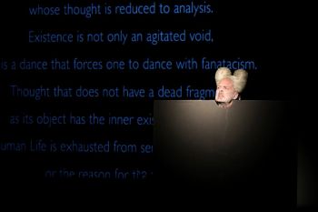 Acephalous Monster; 2018; performance; disembodied head in cut-out responding the text of Georges Bataille, “The Sacred Conspiracy” Ron Athey