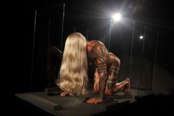 Self-Obliteration; 2011; performance; opening scene with blonde wig and four panes of glass Ron Athey