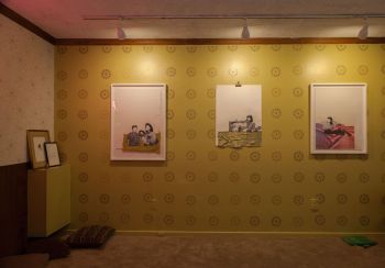 Installation view (3) of Exit Strategies; 2018; carpet, wallpaper, wood laminate, latex paint, acquired furniture, framed documents: acetone transfers on archival paper, mixed media works: collage, glitter, graphite, woven satin damask on hand-cut watercolor paper; dimensions vary Yasmine Diaz