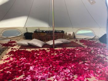 “Sama: The Divine Listening Room”; 2017; installation with tent, devotional tapestries, rose petals, video projection and turntables. Video in collaboration with Amy Alexander. Arshia Fatima Haq