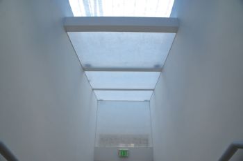 3 Surfaces; 2011; scrims, 4 channel sound, speakers and DVD player; 21 ft. x 7 ft. x 10 ft. Yann Novak
