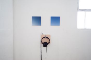 Idleness, Endlessness; 2015; giclée prints on maple plywood; stereo sound, headphones, plywood and hook; 24 in. x 24 in. x 3 in. Yann Novak